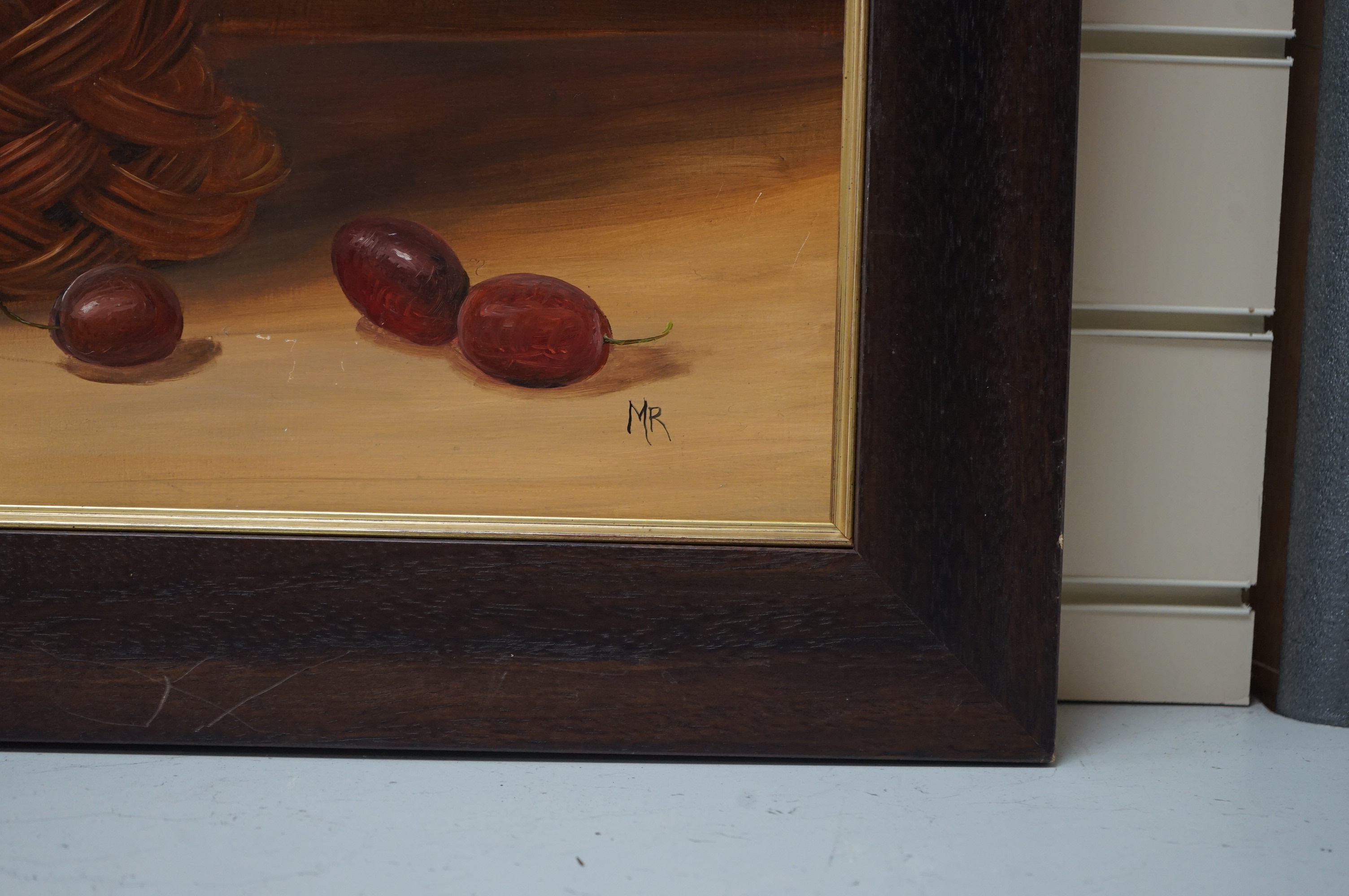 Dutch style oil on board, Still life of fruit in a basket, initialled M.R, 60 x 72cm. Condition - good